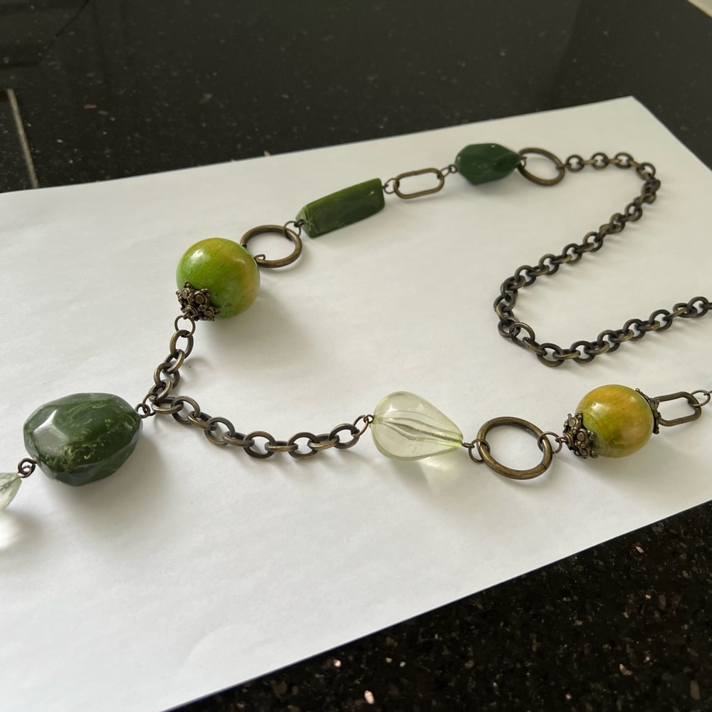 Long necklace with large green beads